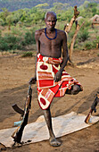 Ethiopia, Southern Nations Nationalities and Peoples' Region, South Omo, Mursiland, Portrait of Mursi tribal man with gun, Maridungka village