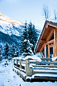 Winter alpine scenery, mountains, snow, pine forest, log cabin in snow, Ortnevik, Sognefjord, Norway