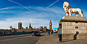 Panoramic view of Houses of Parliament and London Eye from Westminster Bridge with London red bus and black taxi, London, UK