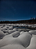 Moonlit Snowy Landscape With The Constellation Orion In The Night Sky, Yukon Canada