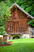 Wooden hut between trees, Styria, Austria