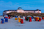 Spa Hotel at dusk, beach chairs, Juist Island, Nationalpark, North Sea, East Frisian Islands, East Frisia, Lower Saxony, Germany, Europe