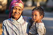 Old woman with child near Ampefy, highlands, Madagascar, Africa