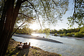 People relaxing at river Isar, Flaucher, Munich, Bavaria, Germany