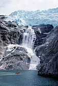 Tourists cruising Beagle Channel beneath Romanche Glacier, Patagonia, Chile