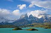 Cuernos del Paine peaks in morning light covered with cumulus clouds, Torres del Paine National Park, Patagonia, Chile