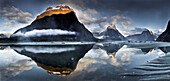 Mitre Peak reflecting in Milford Sound in winter at dawn, Fiordland National Park, New Zealand