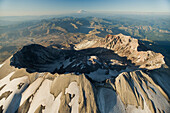 Aerial view of Mount St Helens crater with Mount Rainier behind, Mount St Helens National Volcanic Monument, Washington