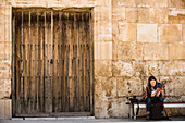 Woman reading a guidebook, Roman Theatre, Amman, Jordan, Middle East