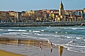 Saint Peter church and Saint Lorenzo beach, Gijon, Asturias, Spain.