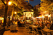 Pavement cafes in Place du Marchee, Le Perron in background, Liege, Wallonia, Belgium