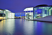 Illuminated Paul Loebe-Haus and Marie-Elisabeth Lueders-Haus along the river Spree, architect Stephan Braunfels, Berlin, Germany