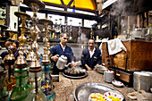 Waiter making tea and preparing hookahs in the teashop, Istanbul, Turkey
