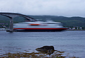 ship under the bridge across the Sortlandsundet, Isles of Vesteralen, Province of Nordland, Nordland, Norway, Europe