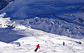 People skiing down the slope, skiing area with gypsumholes, Lech in Arlberg, Winter in Vorarlberg, Austria