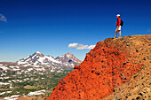 A hiker taking in the scenery of a mountain range Bend, Oregon, USA