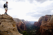 A female hiker enjoys the view from the top of Angel's Landing Trail, Zion National Park, Utah Zion National Park, Utah, USA