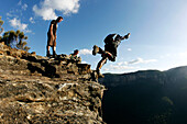 A BASE jumper performs a front flip off a cliff in the Blue Mountains, New South Wales, Australia Blue Mountains, New South Wales, Australia