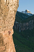 A woman rock climbing on a Via Ferrata outside Telluride, Colorado Telluride, Colorado, USA