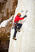 A man is climbing a frozen waterfall in Sounkyo Gorge, Daisetsuzan National Park, Hokkaido, Japan, Hokkaido, Japan