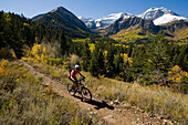 Female mountain biker riding in mountains, Provo, Utah.++, Provo, Utah, United States