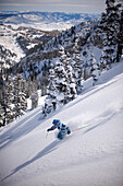 Man skiing deep powder, Alta, Utah Alta, Utah, USA