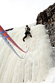 A man ice climbing Bozeman, Montana, USA