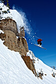 A man skis off a cliff in Wyoming Alta, Wyoming, USA