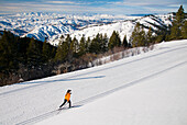 Woman cross country or nordic skiing in the mountains at Bogus Basin Boise, Idaho, USA