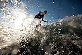 Male wakesurfing in Idaho Sandpoint, Idaho, USA