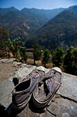 Old shoes point off towards the Himalayan foothills in Nepal Annapurna Conservation Area, Nepal
