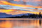 A brilliant fall sunrise is reflected in Lake Tahoe, California Lake Tahoe, California, USA