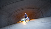 A man exiting a tunnel, running with his twin boys in a stroller in Helena, Alabama Helena, Alabama, United States