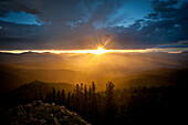 Setting sun lighting up rain in a mountain valley.  Cuchara, Colorado, United States Cuchara, Colorado, United States