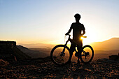 A silhouette of a mountain biker at sunset on Gooseberry Mesa in southern Utah Gooseberry Mesa, Utah, USA