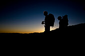 Two backpackers watch the sunset at Castle Rock State Park, California. Silhouette Castle Rock, California, United States of America