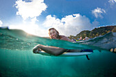 A split level view of a surfer at Monster Mush, on the north shore of Oahu, Hawaii, north shore, Oahu, Hawaii, USA