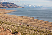 A woman out for an afternoon trail run on Antelope Island, Utah Utah, USA