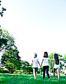 three friends walk on the western prom in portland, me, portland, me, usa