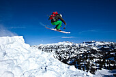 A young man skiing jumps off a cornice in Montana., Bozeman, Montana, USA