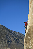 Male lead climbing on a boulder, Bishop, California, United States
