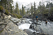 Fly fisherman on river in winter South Lake Tahoe, California, United States