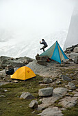 Man at scenic campsite, Bugaboos Provincial Park, British Columbia, Canada Golden, British Columbia, Canada