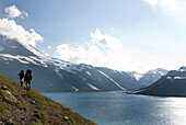 Two backpackers follow a trail around an alpine lake near the border of Chile and Argentina Chile