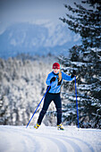 A young woman cross-country skiing Homer, Alaska, USA