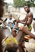 Men and boys playing percussions, Voudoun ceremony, Agbanakin, Togo