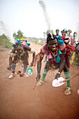 Togolese family dancing and celebrating on street, Taneka-Beri, Benin