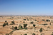 Fields and farmer huts, Gheralta mountains in background, Feraywi, Tigray region, Ethiopia