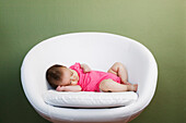 Baby sleeping on chair, Seattle, WA