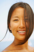 Close up of Asian woman smiling, Cape Cod, MA